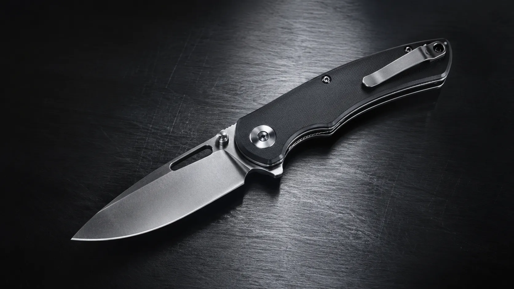 Open pocket knife on dark steel surface for a complete pocket knife guide